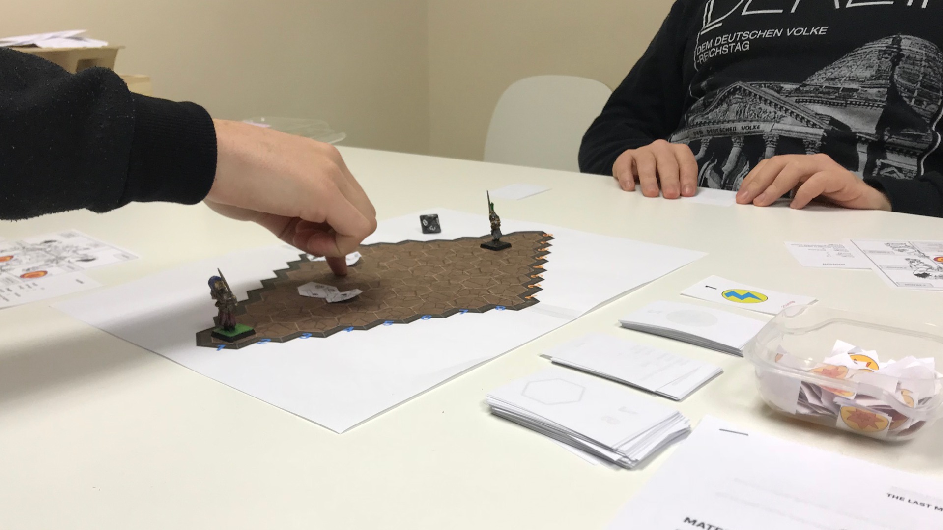 Photo of a paper prototype of The Last Mech in play.
