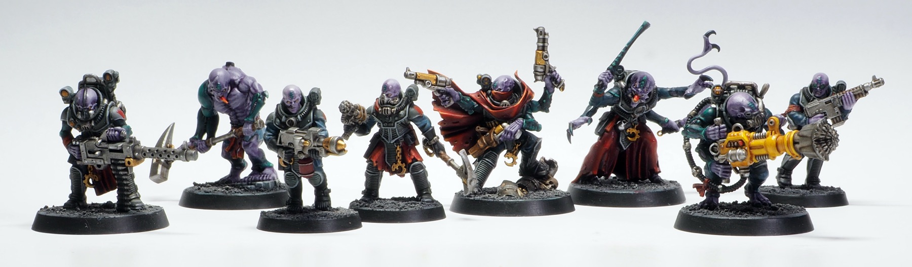 A photograph of various Genestealer Cults models painted by me