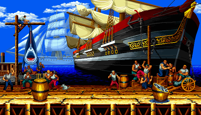 An animated screenshot of a fighting game background which features a pier with a revolving shark, sailing ship at dock, and various seamen